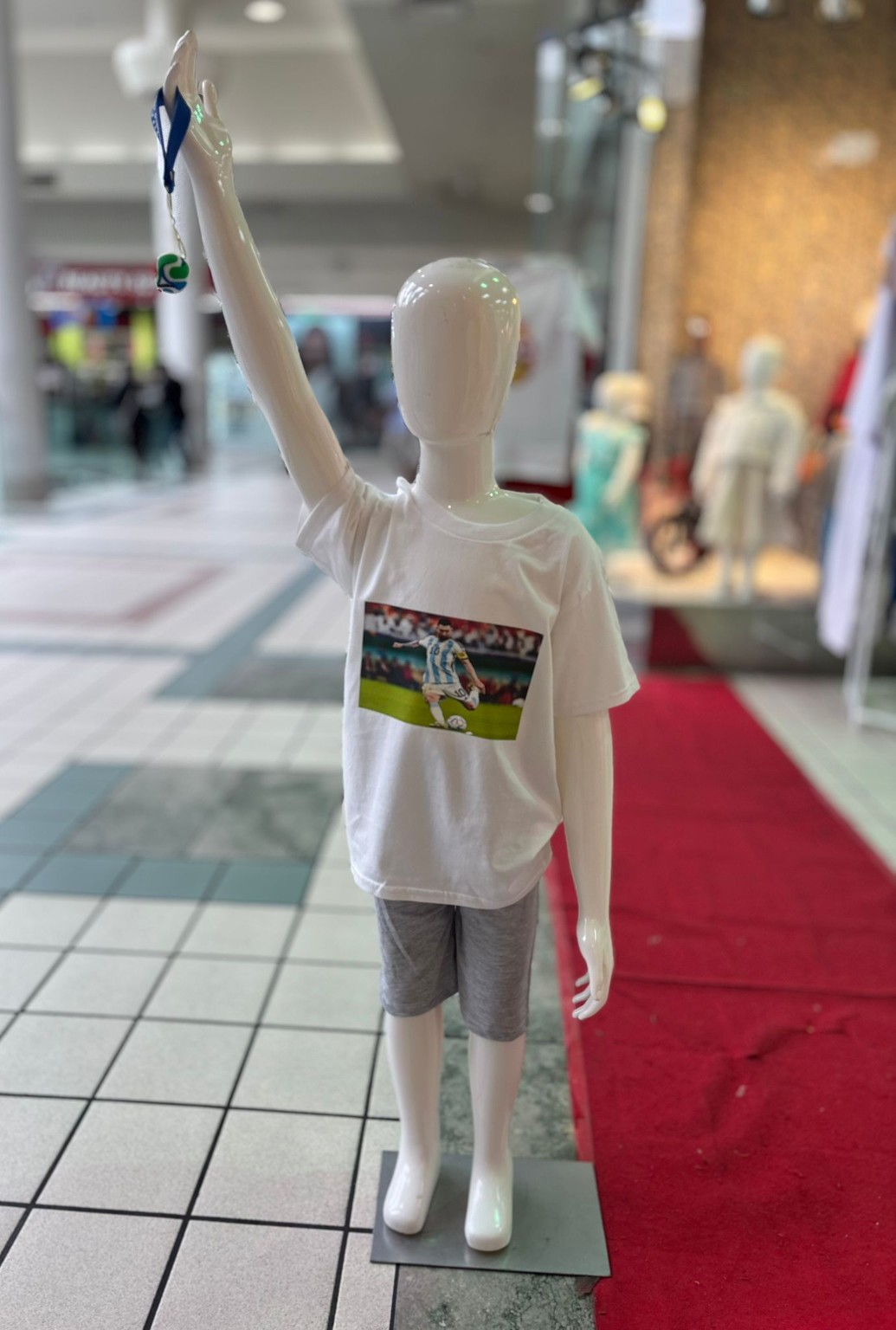 Custom printed kids shirt displayed in store